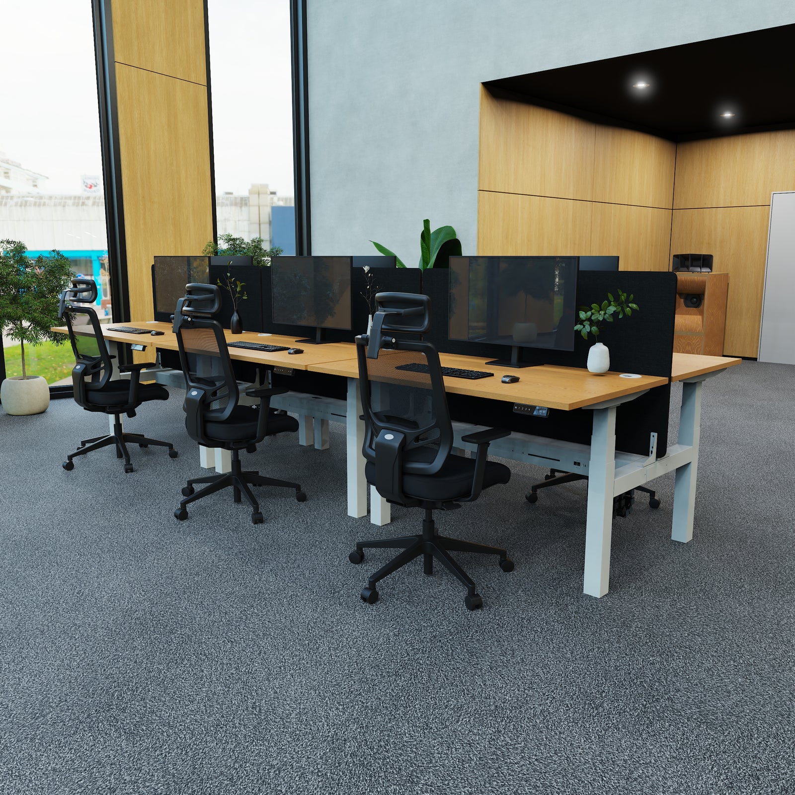 Modern office setup with desks, chairs, and computer monitors.